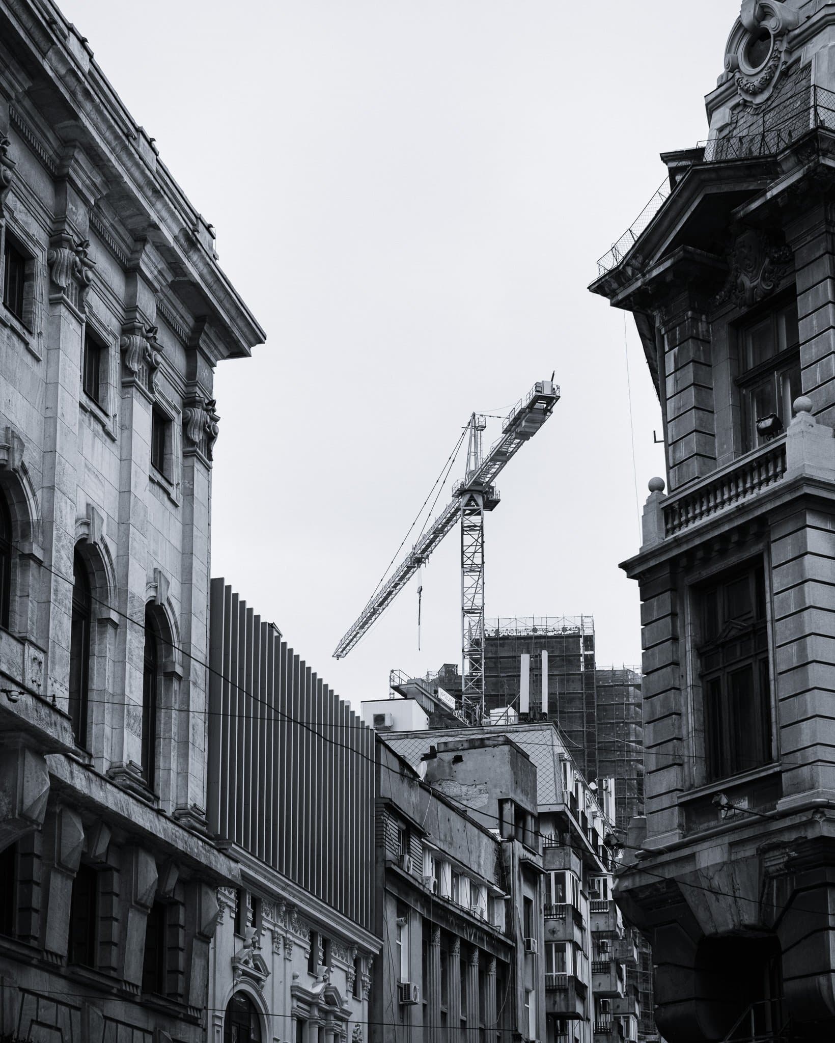 Steel bones rising from stone roots; the necessary destruction of progress.